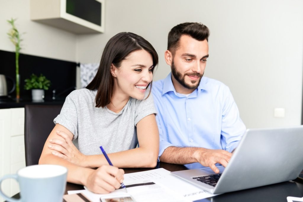 Couple filling tax return form