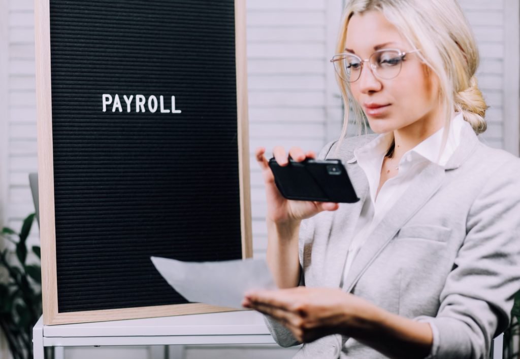 Young business woman uses remote deposit capture